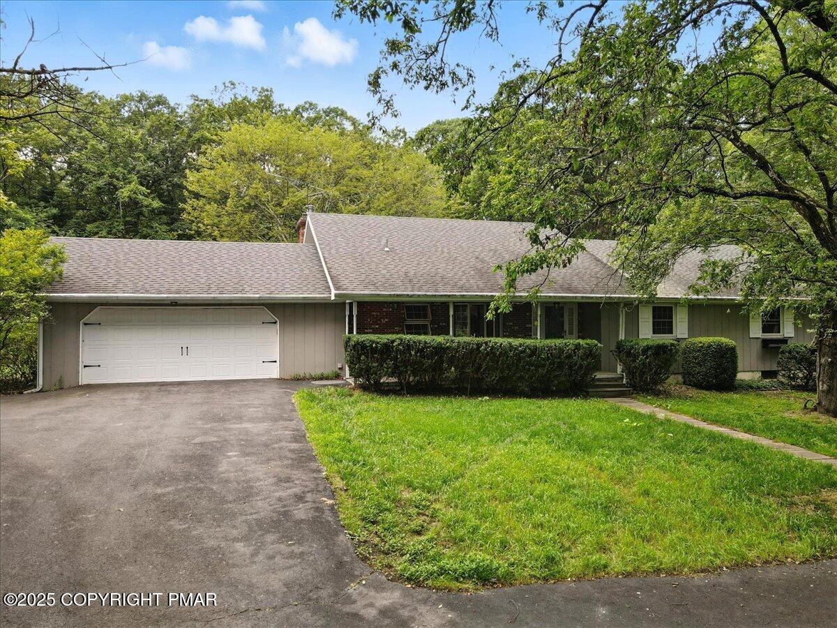 142 Pine Grove Road Kunkletown, PA 18058 - Photo 3 of 78 a view of a house with a garden and yard