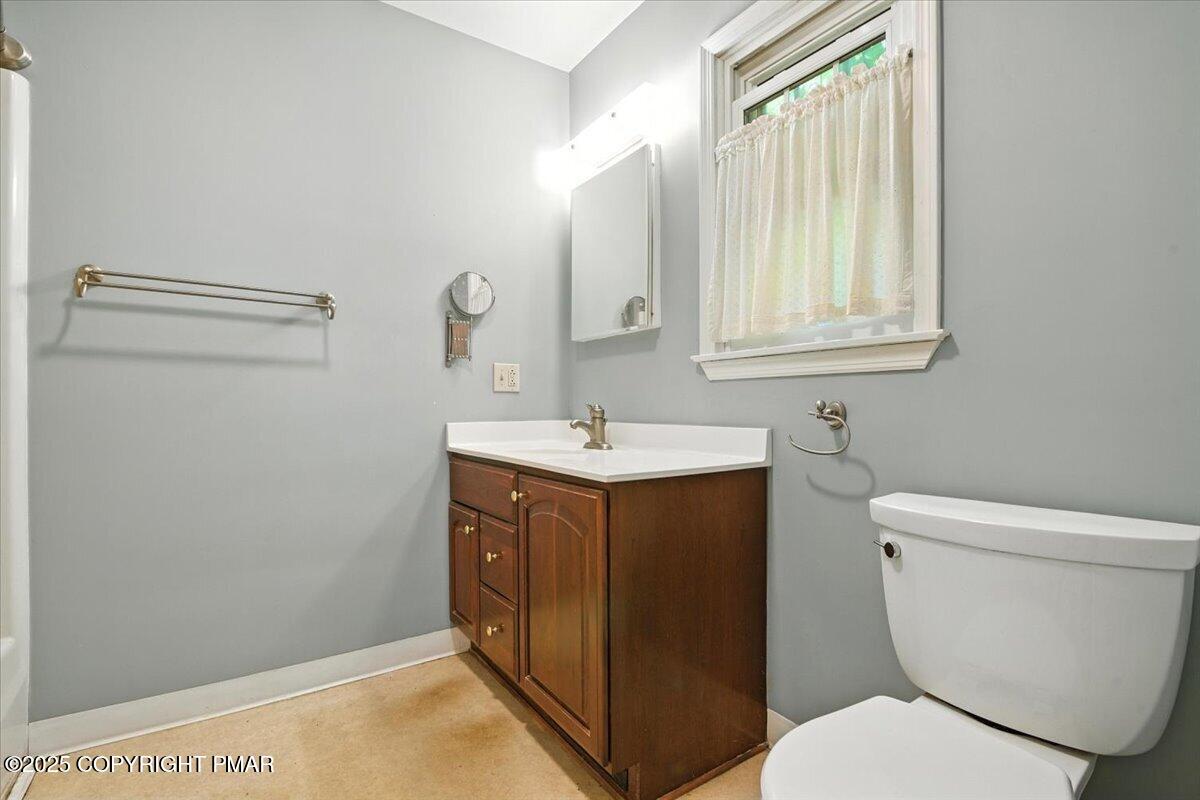 142 Pine Grove Road Kunkletown, PA 18058 - Photo 35 of 78 a bathroom with a sink vanity and a toilet