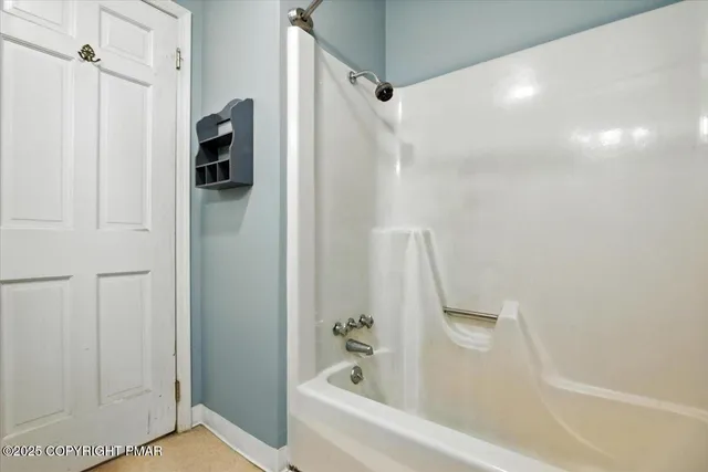 a view of an empty room with a fireplace