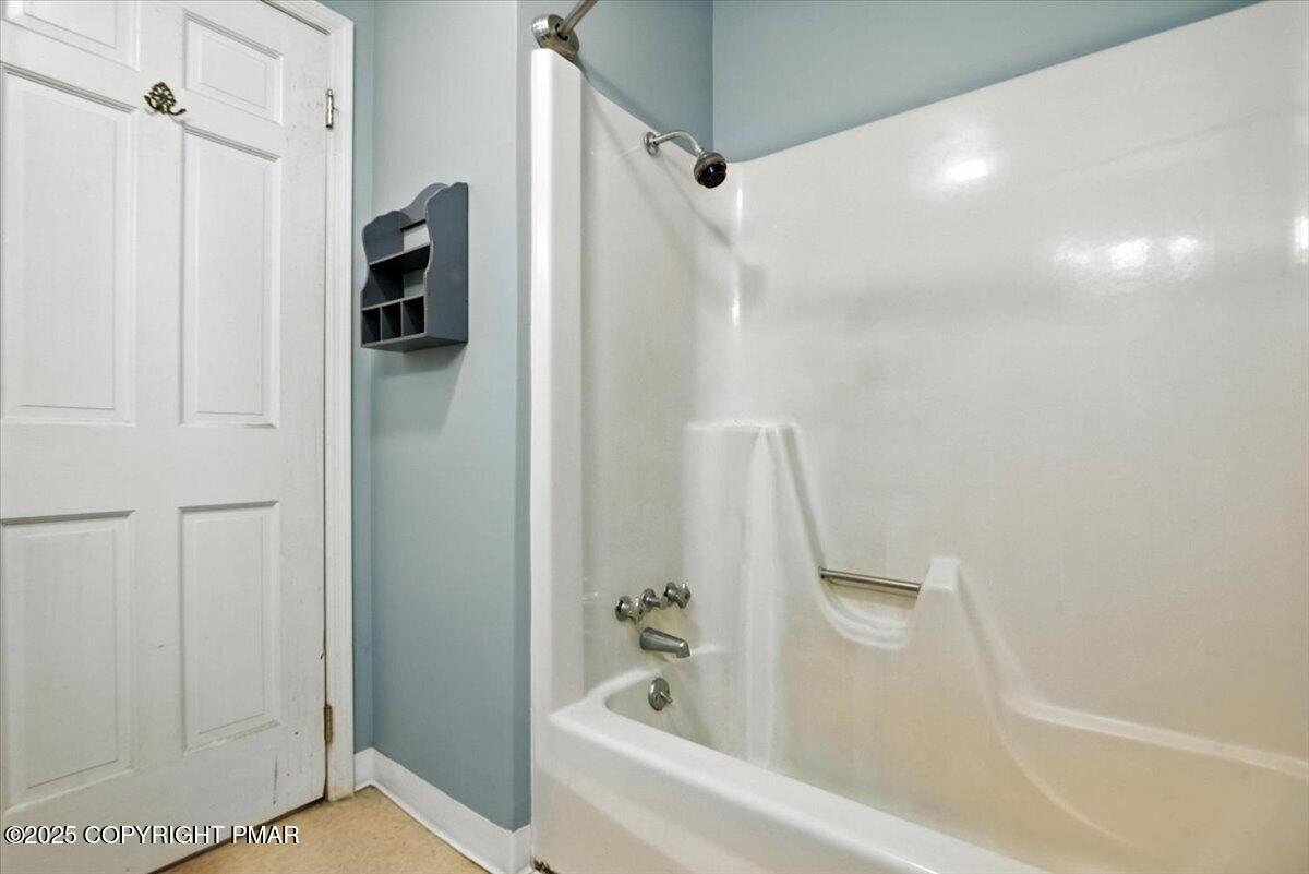 142 Pine Grove Road Kunkletown, PA 18058 - Photo 36 of 78 a bathroom with a bathtub and a shower