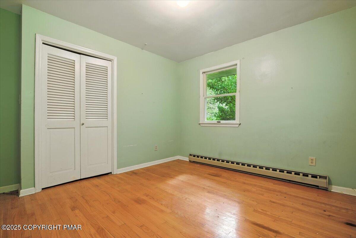 142 Pine Grove Road Kunkletown, PA 18058 - Photo 39 of 78 an empty room with wooden floor and windows