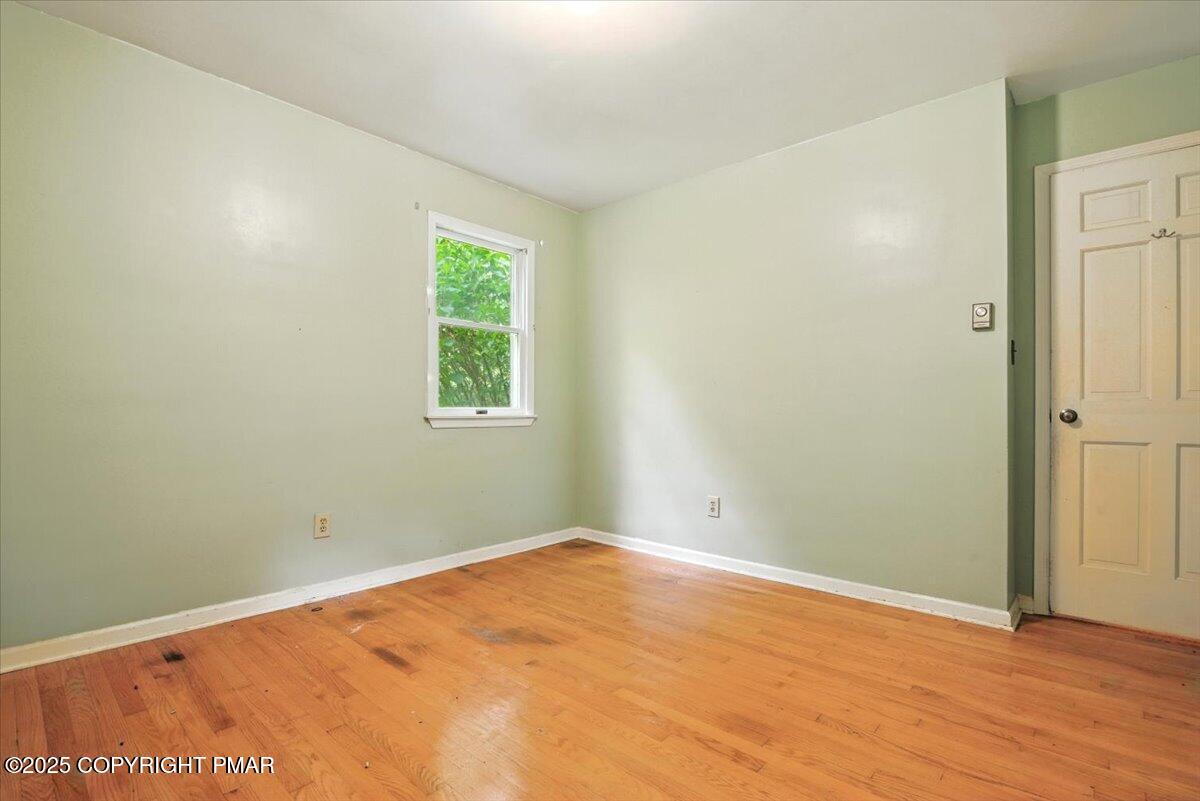 142 Pine Grove Road Kunkletown, PA 18058 - Photo 40 of 78 an empty room with wooden floor and windows