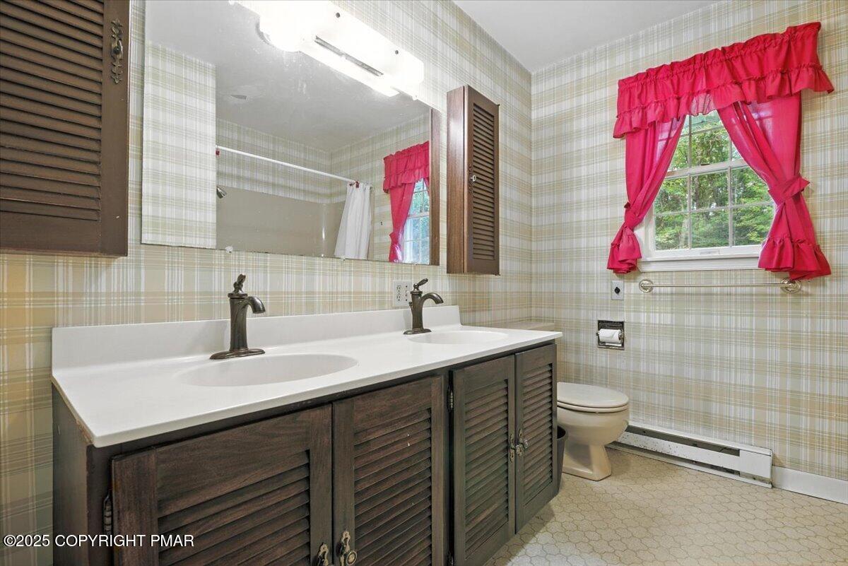 142 Pine Grove Road Kunkletown, PA 18058 - Photo 41 of 78 a bathroom with a sink vanity mirror and window