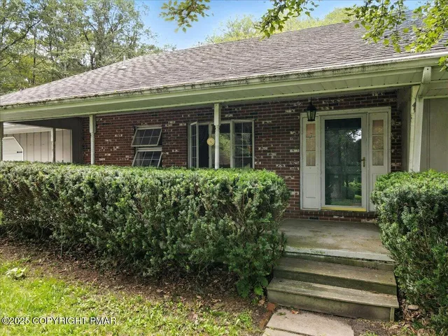 a view of a livingroom with wooden floor