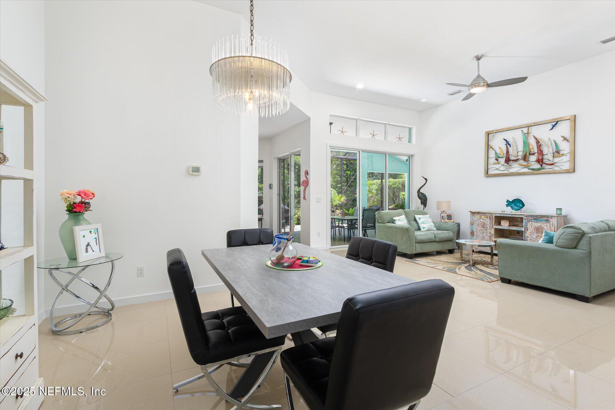 132 Bottlebrush Drive St. Augustine, FL 32086 - Photo 14 of 56 a living room with furniture and a table