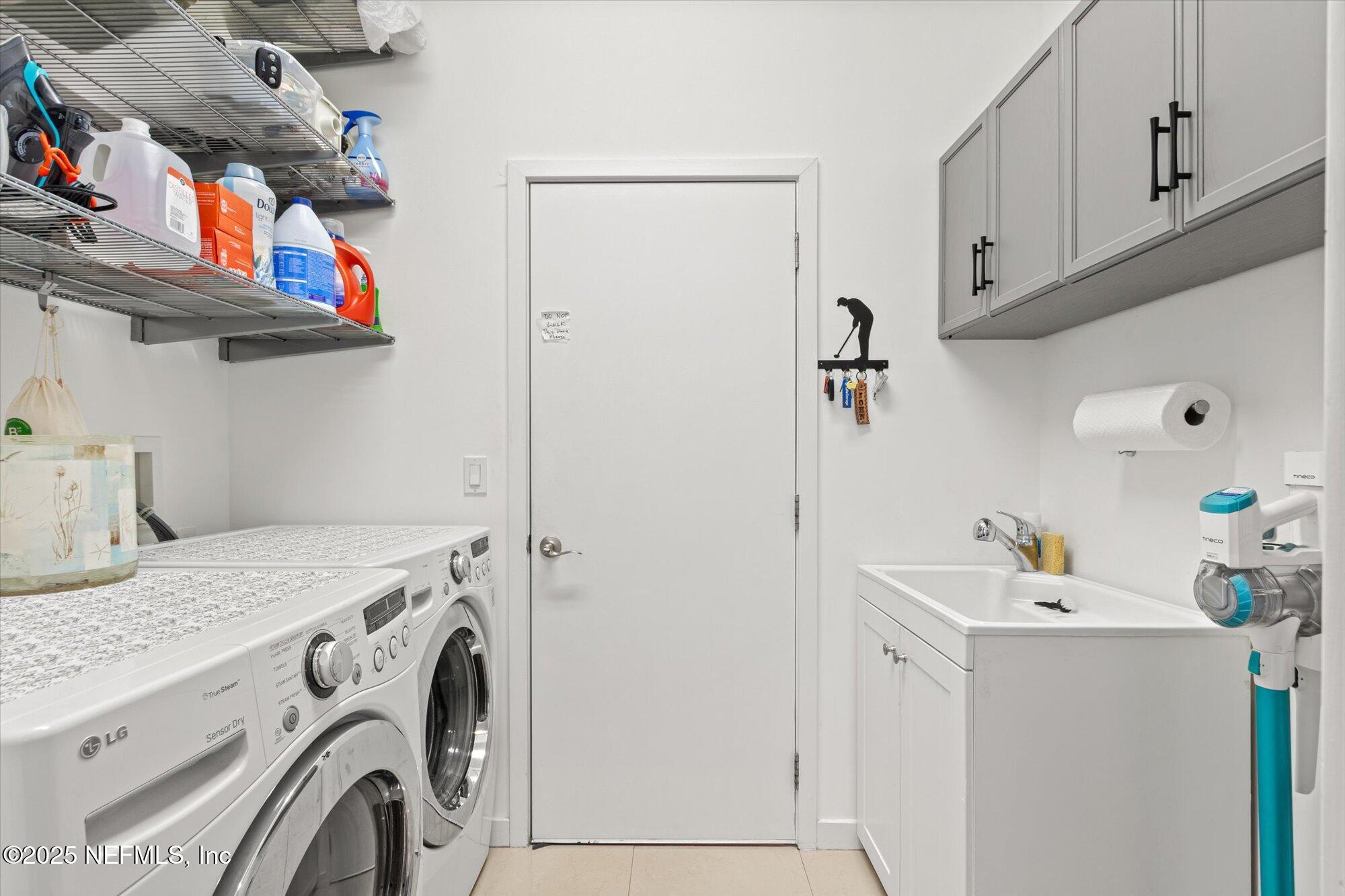 132 Bottlebrush Drive St. Augustine, FL 32086 - Photo 16 of 56 a utility room with dryer and washer