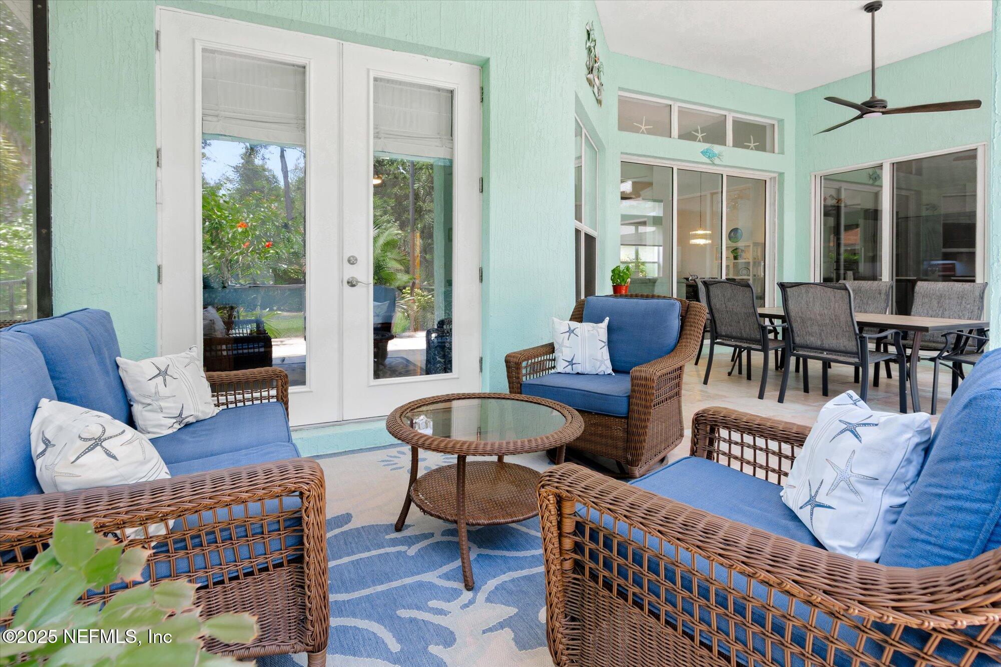 132 Bottlebrush Drive St. Augustine, FL 32086 - Photo 33 of 56 a living room with furniture and a large window