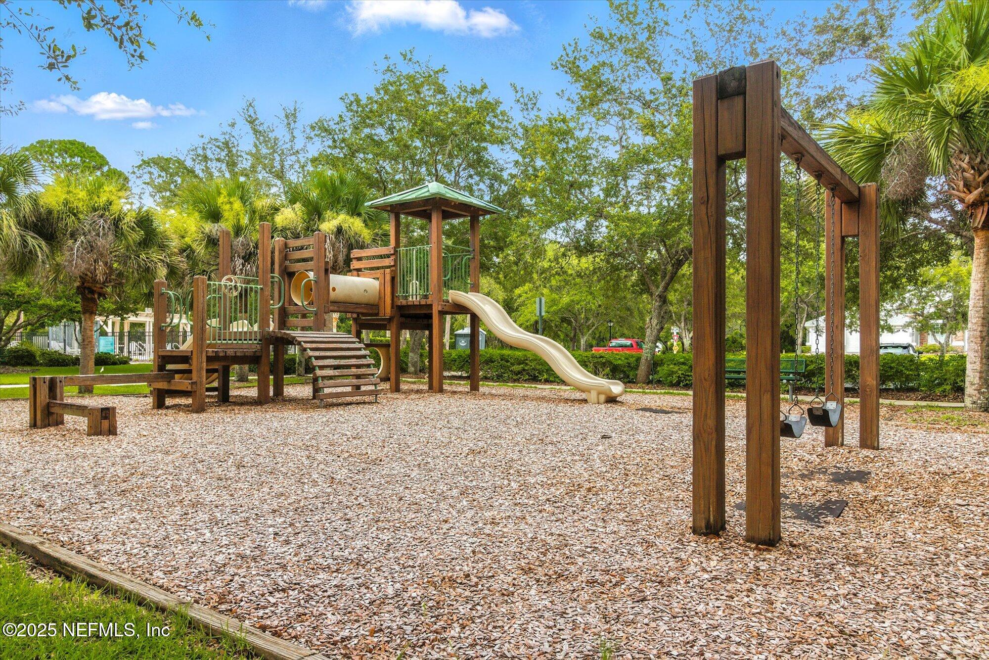 132 Bottlebrush Drive St. Augustine, FL 32086 - Photo 52 of 56 a view of a park with swings and slides
