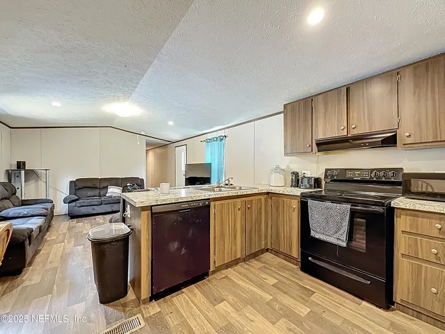 a bedroom with bed and a window