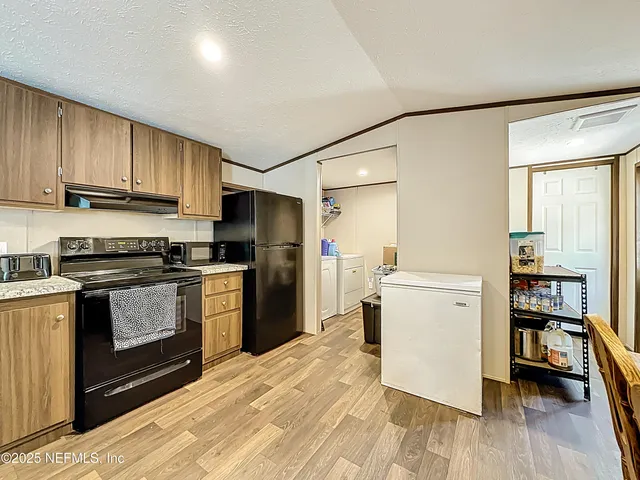 a bedroom with a bed and a mirror