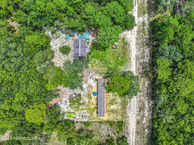 an aerial view of residential house with outdoor space