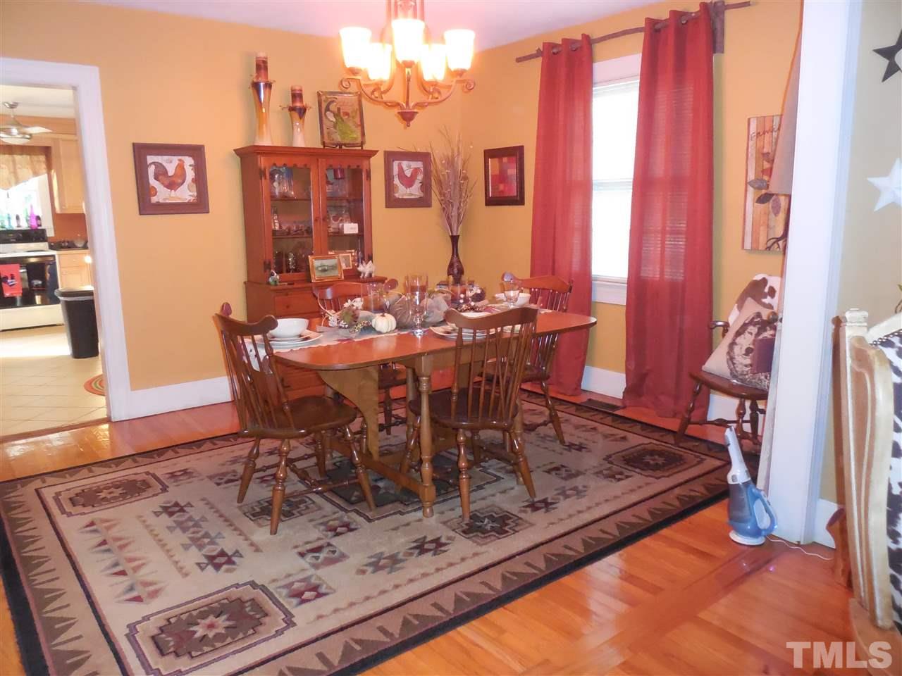 2150 Sanders Road Stem, NC 27581 - Photo 7 of 13 a view of a dining room with furniture