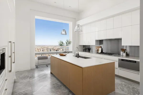 a kitchen with a sink and a refrigerator