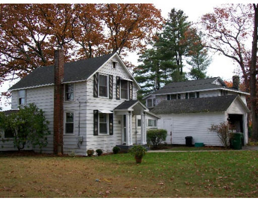 128 Barton Road Stow, MA 01775 - Photo 1 of 1 a front view of a house with a garden
