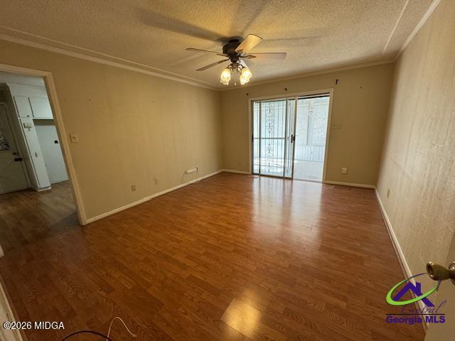 309 North Pleasant Hill Road Warner Robins, GA 31093 - Photo 13 of 23 a view of an empty room with window and wooden floor
