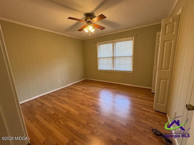 309 North Pleasant Hill Road Warner Robins, GA 31093 - Photo 16 of 23 a view of an empty room with a window and wooden floor