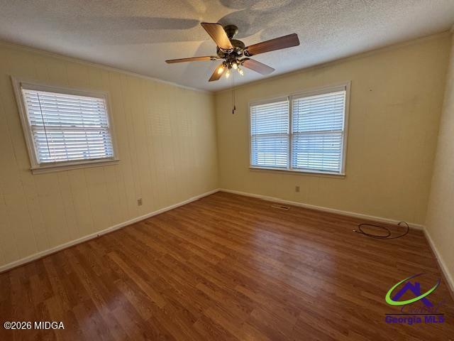 309 North Pleasant Hill Road Warner Robins, GA 31093 - Photo 19 of 23 a view of an empty room with a window and wooden floor