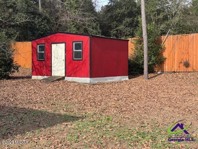 309 North Pleasant Hill Road Warner Robins, GA 31093 - Photo 22 of 23 a view of a red house with a yard