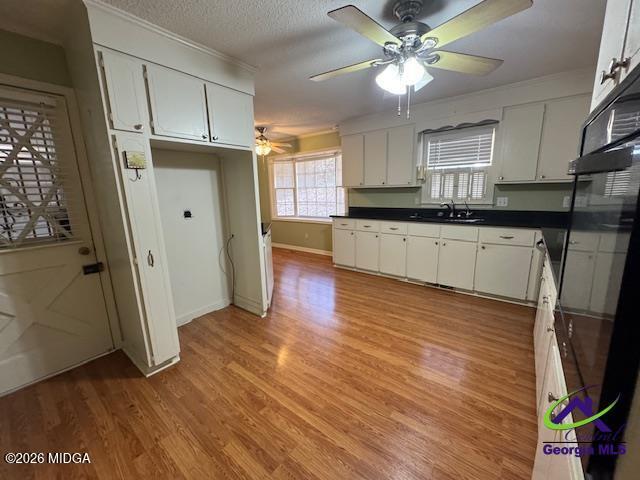 309 North Pleasant Hill Road Warner Robins, GA 31093 - Photo 3 of 23 a kitchen with stainless steel appliances granite countertop a refrigerator a sink dishwasher a stove and white countertops with wooden floor