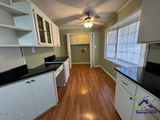 a kitchen with cabinets a sink and appliances