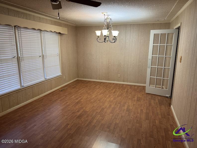 309 North Pleasant Hill Road Warner Robins, GA 31093 - Photo 7 of 23 an empty room with wooden floor and windows