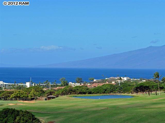 44 Anapuni Loop, Unit 3 Lahaina, HI 96761 - Photo 1 of 18 a view of a big yard with a building in the background