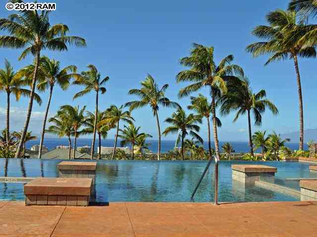 44 Anapuni Loop, Unit 3 Lahaina, HI 96761 - Photo 7 of 18 a view of swimming pool with a plant and palm trees
