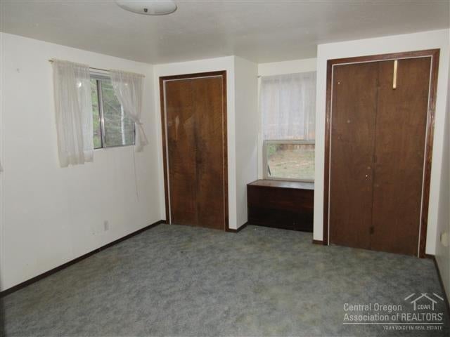 Master bedroom with 2 closets and access