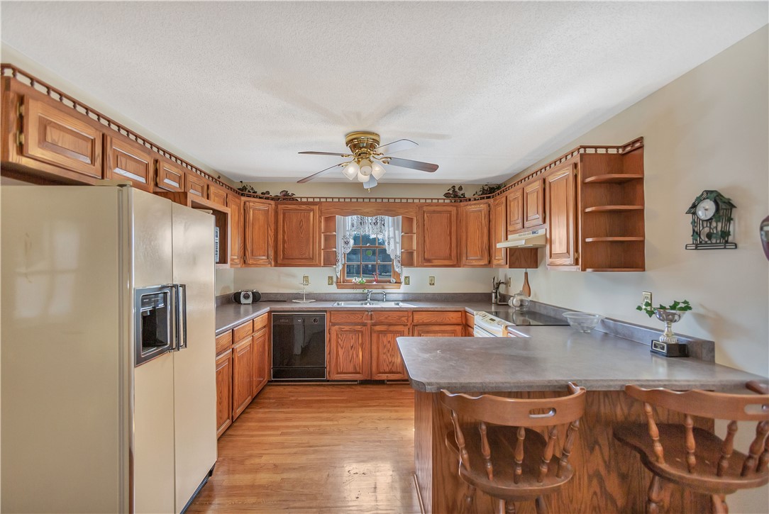 1116 Green Willow Trail Anderson, SC 29621 - Photo 11 of 45 This bright kitchen features wood cabinetry and a functional layout, perfect for everyday living.