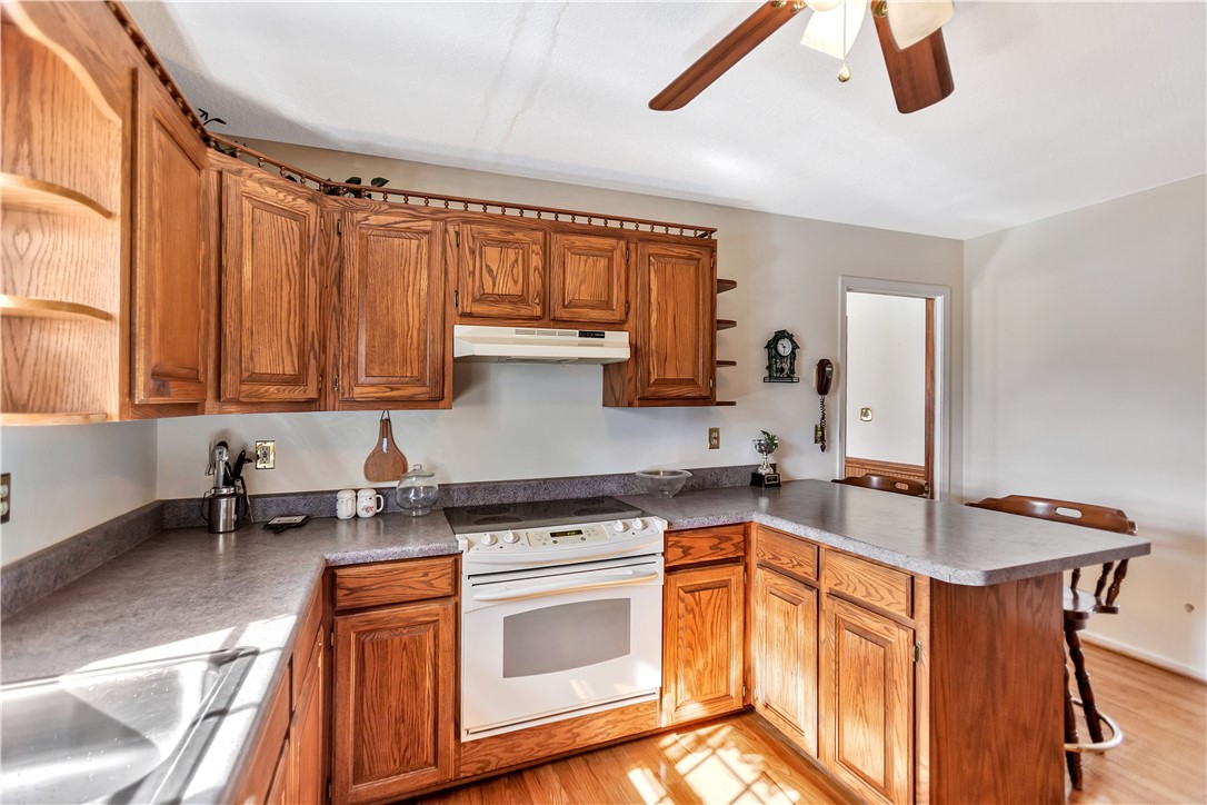 1116 Green Willow Trail Anderson, SC 29621 - Photo 12 of 45 This spacious kitchen offers ample cabinetry and an inviting breakfast bar.