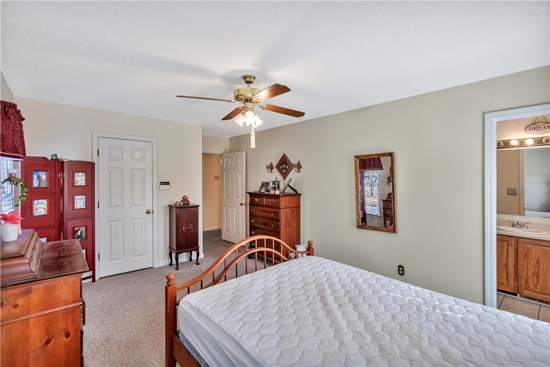 1116 Green Willow Trail Anderson, SC 29621 - Photo 19 of 45 This spacious bedroom offers ample comfort, featuring soft carpeting and a private entrance to the bathroom.