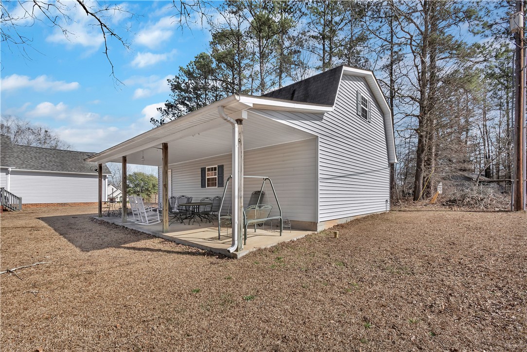 1116 Green Willow Trail Anderson, SC 29621 - Photo 26 of 45 Enjoy outdoor living on this expansive covered patio, ideal for relaxation.