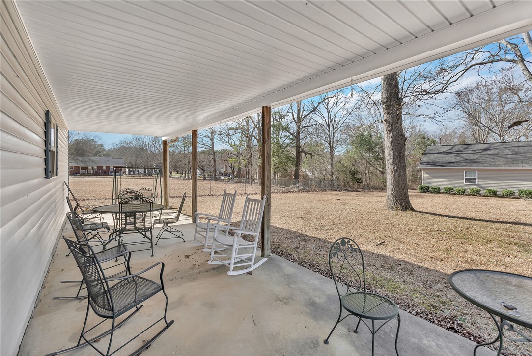 1116 Green Willow Trail Anderson, SC 29621 - Photo 27 of 45 This inviting covered porch provides a serene outdoor retreat, perfect for enjoying quiet moments.