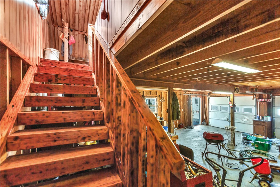 1116 Green Willow Trail Anderson, SC 29621 - Photo 28 of 45 This garage offers ample space, exposed beam ceiling, and a functional staircase.