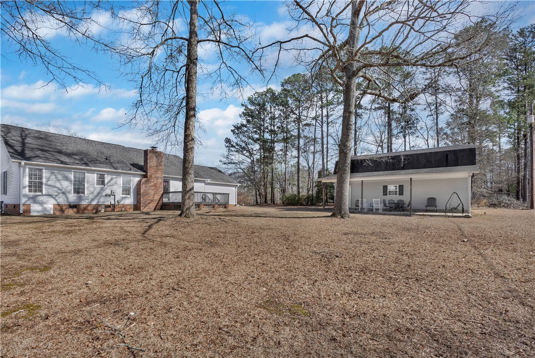 1116 Green Willow Trail Anderson, SC 29621 - Photo 34 of 45 This spacious property features a charming home and a separate outbuilding, surrounded by mature trees.