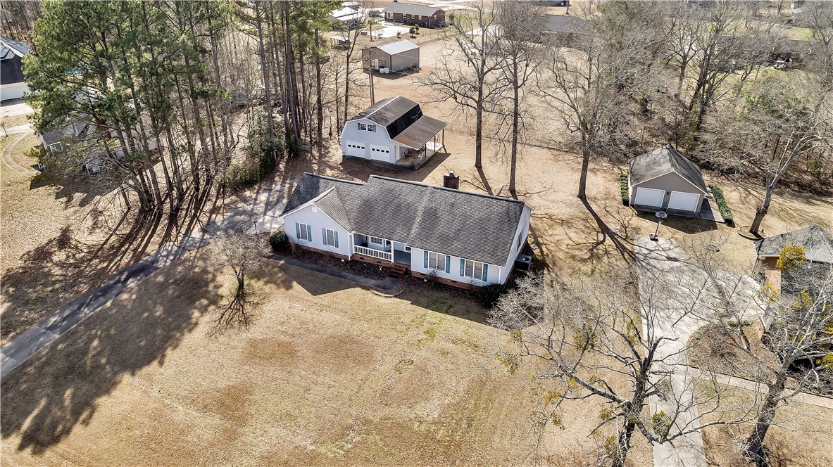 1116 Green Willow Trail Anderson, SC 29621 - Photo 38 of 45 An aerial perspective reveals a charming ranch home nestled amidst a spacious, tree-lined property.
