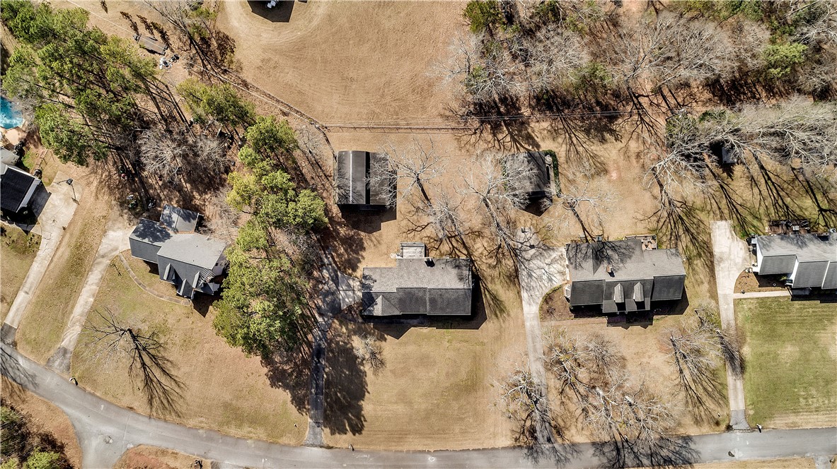 1116 Green Willow Trail Anderson, SC 29621 - Photo 41 of 45 An aerial view showcases multiple homes nestled amidst mature trees and expansive grounds.