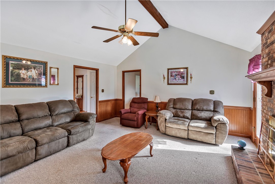 1116 Green Willow Trail Anderson, SC 29621 - Photo 5 of 45 This inviting living space features vaulted ceilings and a classic brick fireplace, creating a warm ambiance.