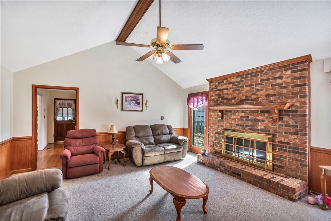 1116 Green Willow Trail Anderson, SC 29621 - Photo 7 of 45 This inviting living area boasts vaulted ceilings and a warm brick fireplace, creating a cozy atmosphere.