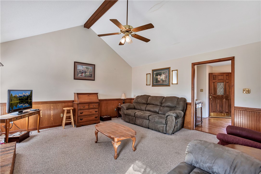 1116 Green Willow Trail Anderson, SC 29621 - Photo 8 of 45 This living room features vaulted ceilings and wood paneling, creating a warm and inviting atmosphere.