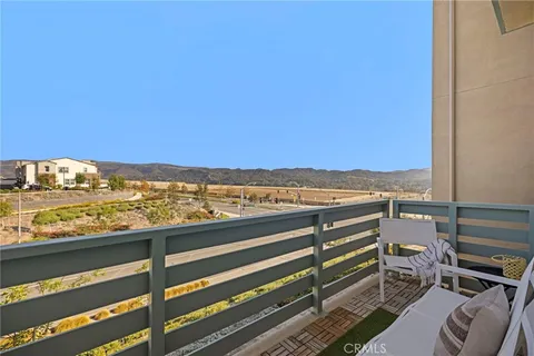 a view of balcony with furniture