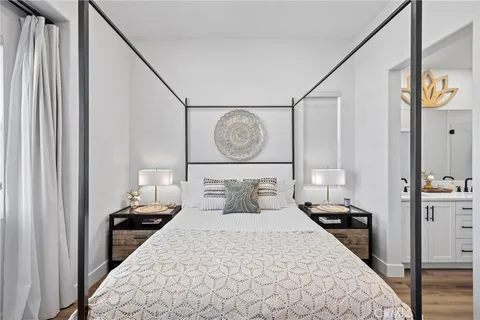 a bedroom with a bed and a chair