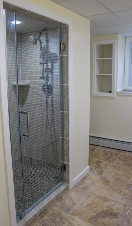 43 Overhill Road Warren, RI 02885 - Photo 14 of 21 A beautifully-tiled walk-in shower with quality glass door is included.