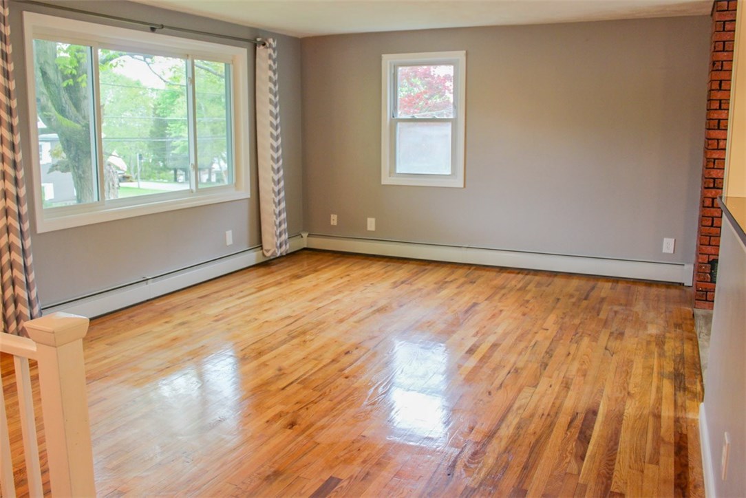43 Overhill Road Warren, RI 02885 - Photo 7 of 21 Another view of the living room, floors gleaming.