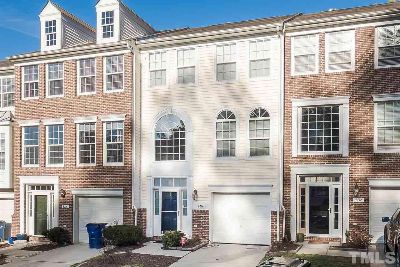 4714 Longhill Lane Raleigh, NC 27612 - Photo 1 of 19 a front view of a building with a lot of windows