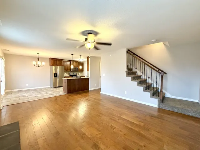 a view of a kitchen with a sink and a chandelier