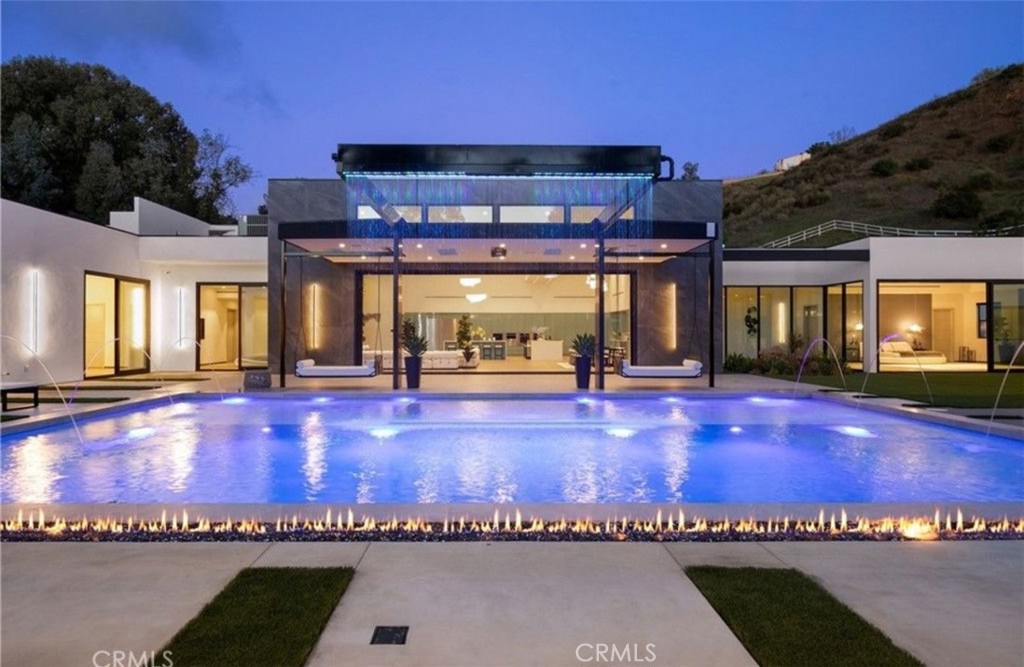 a view of a swimming pool with an outdoor space