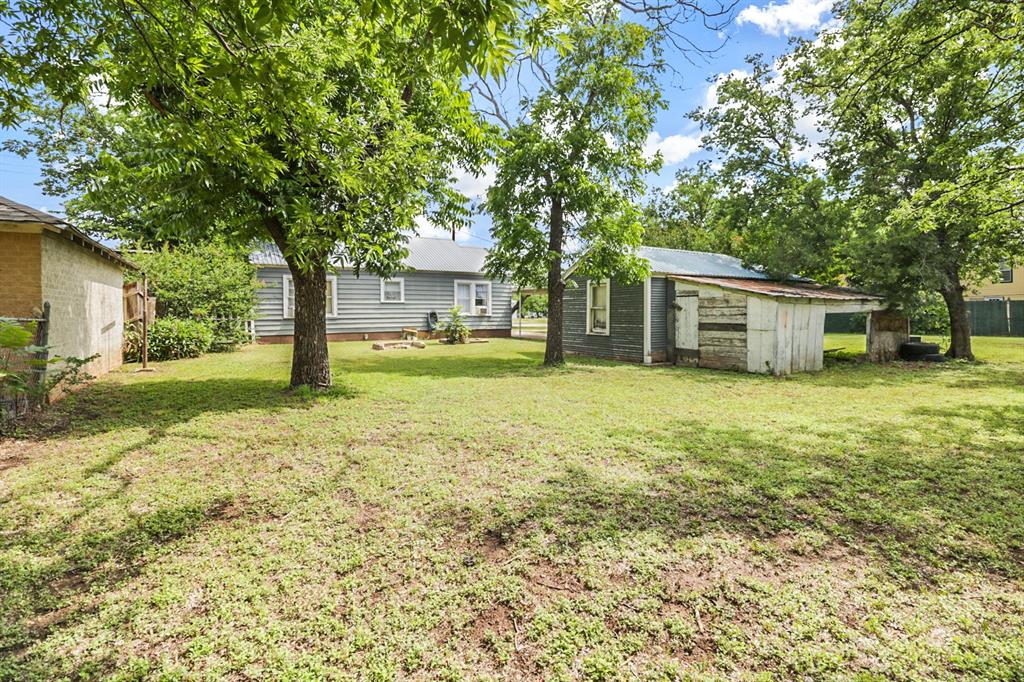 605 West Walnut Street Coleman, TX 76834 - Photo 15 of 18 a view of a house with yard and tree s