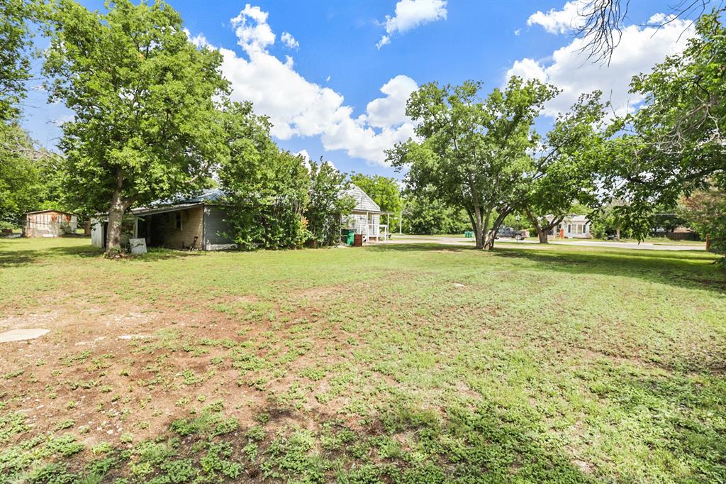 605 West Walnut Street Coleman, TX 76834 - Photo 18 of 18 a view of a swimming pool with an outdoor space and seating area