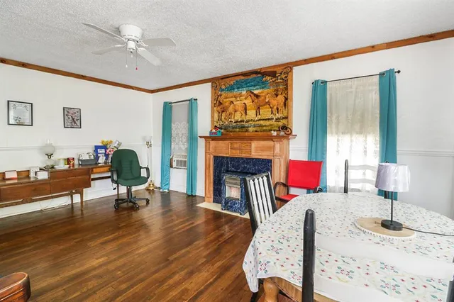 a living room with furniture fireplace and flat screen tv